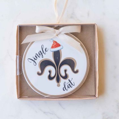 xmas ornament that says "jingle dat" written on it with a symbol